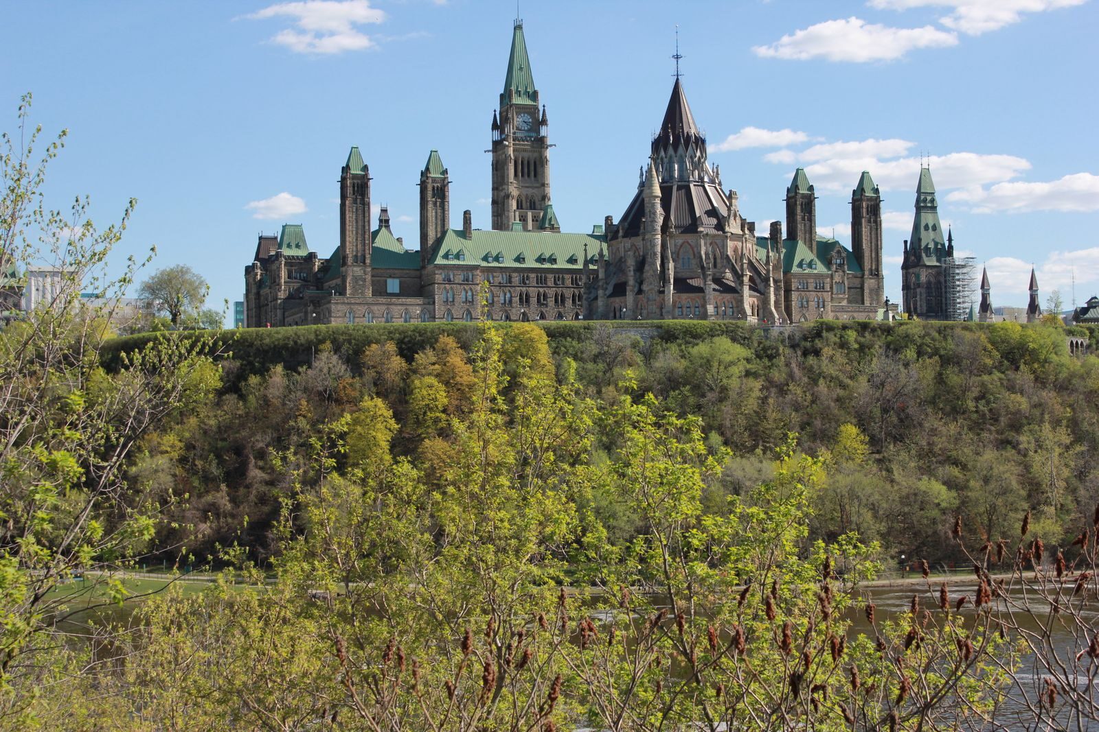 Ottawa Parliament Buildings in spring with green trees