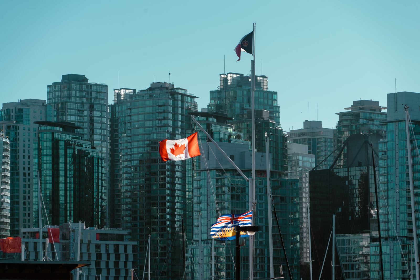 Vancouver skyscrapers with Canadian and British Columbia flags