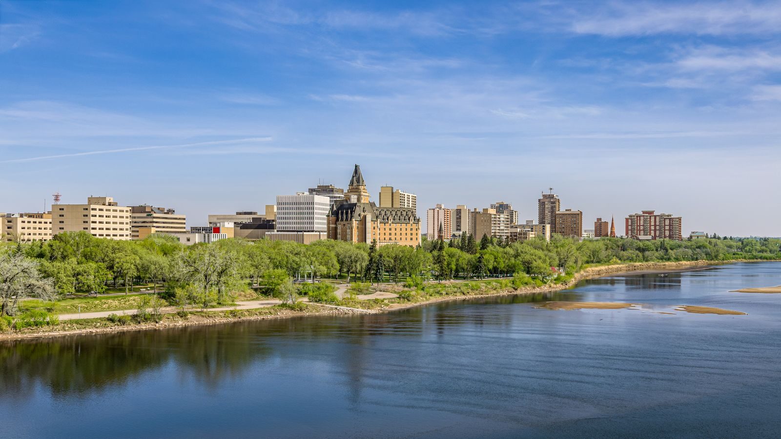 Saskatoon skyline above the riverbank park in spring